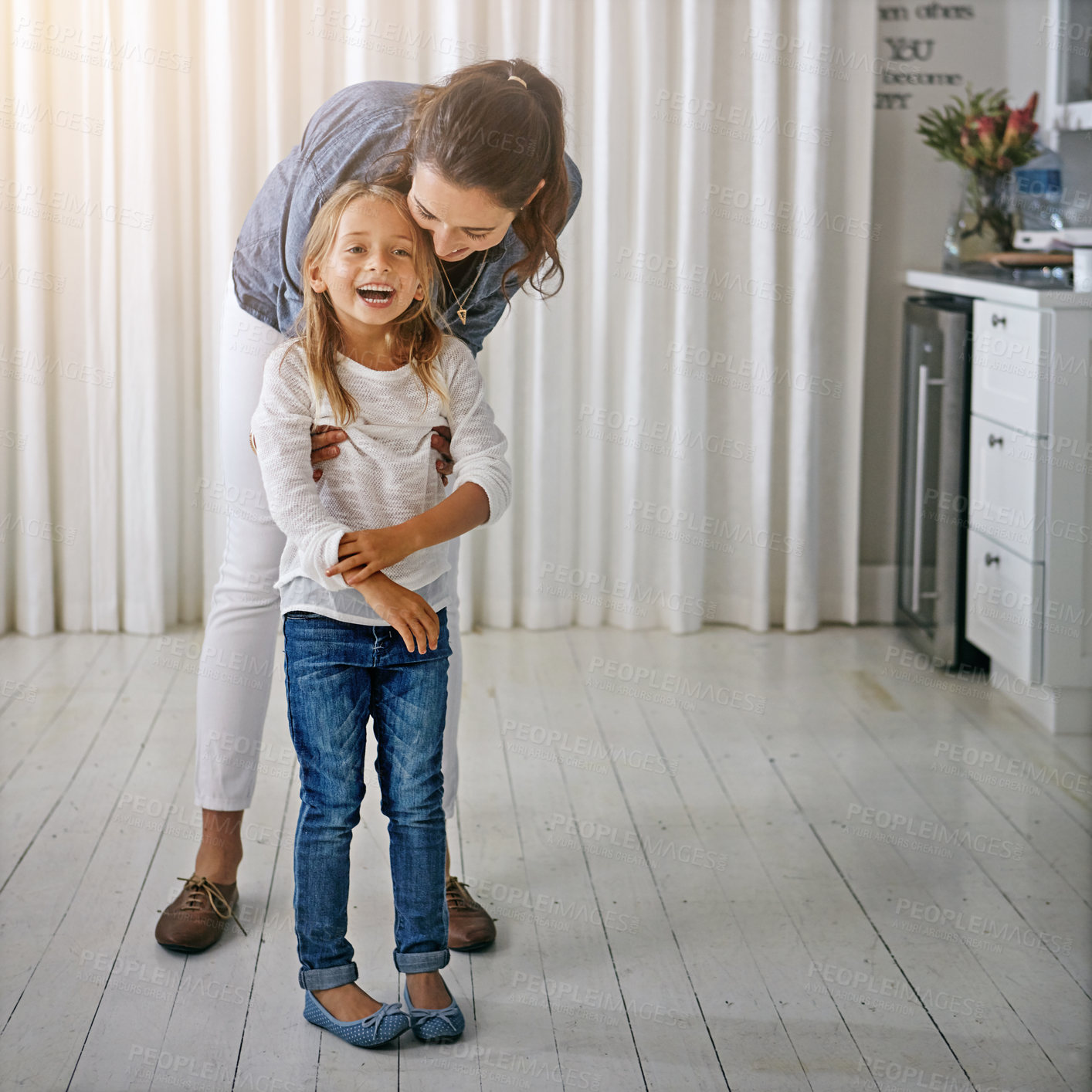 Buy stock photo Shot of a mother and her daughter spending quality time at home