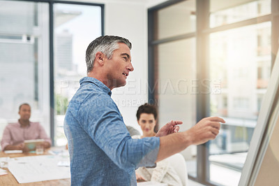 Buy stock photo Cropped shot of a mature businessman giving a presentation