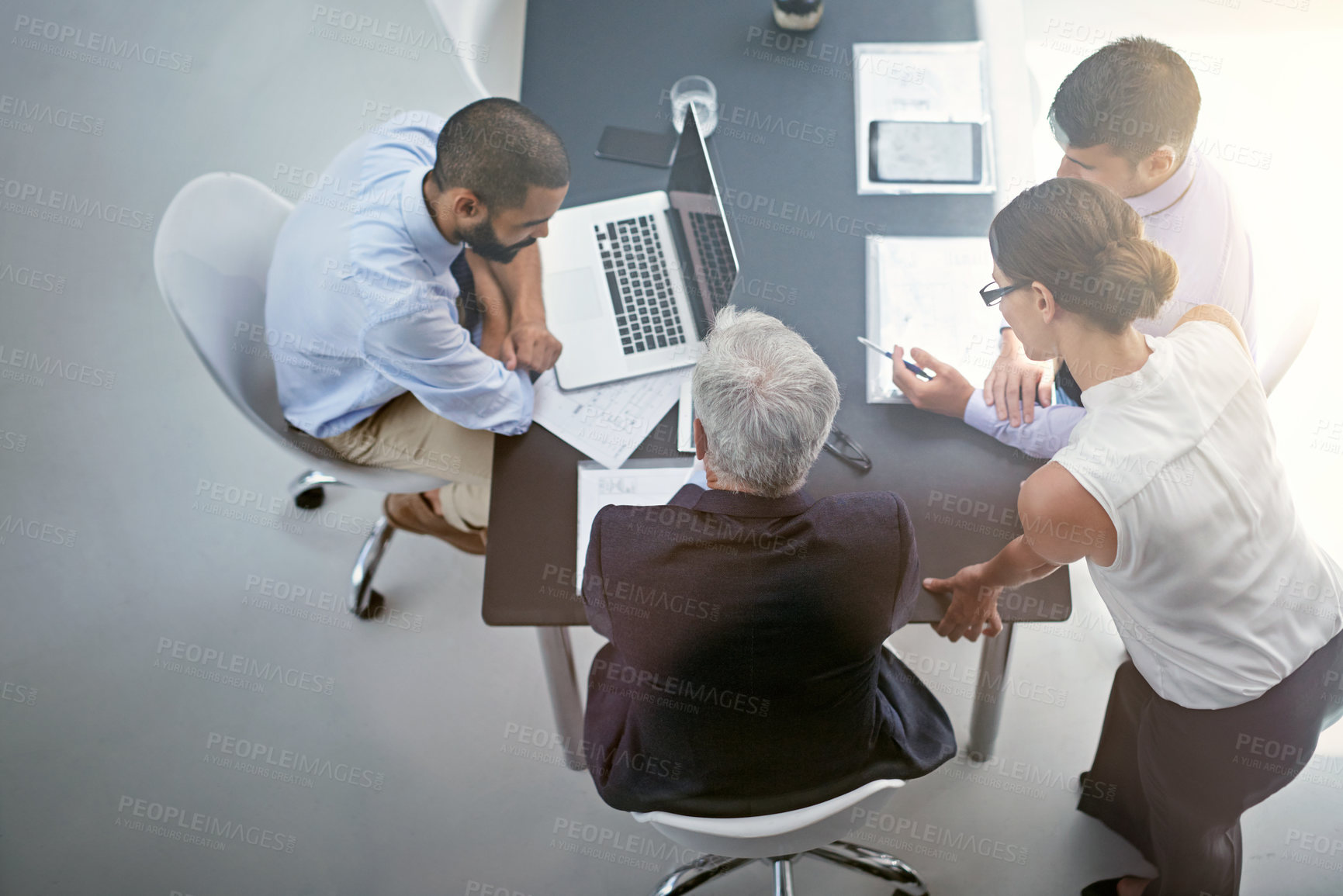 Buy stock photo Shot of corporate businesspeople having a meeting in an office