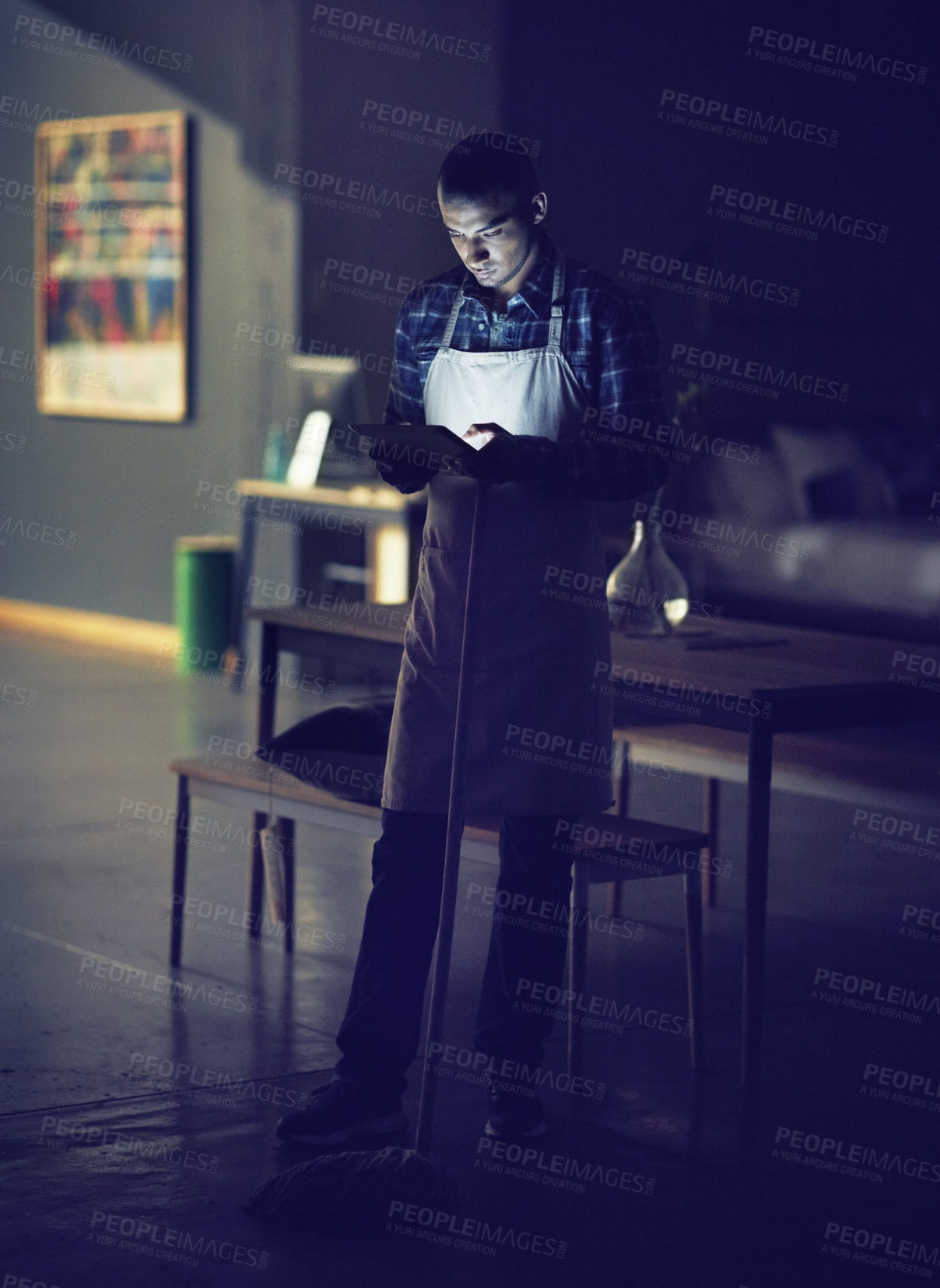 Buy stock photo Man, reading and tablet at night in cafe with mop for cleaning, inventory information and typing feedback. Male owner, digital and overtime with maintenance inspection, communication and shop hygiene