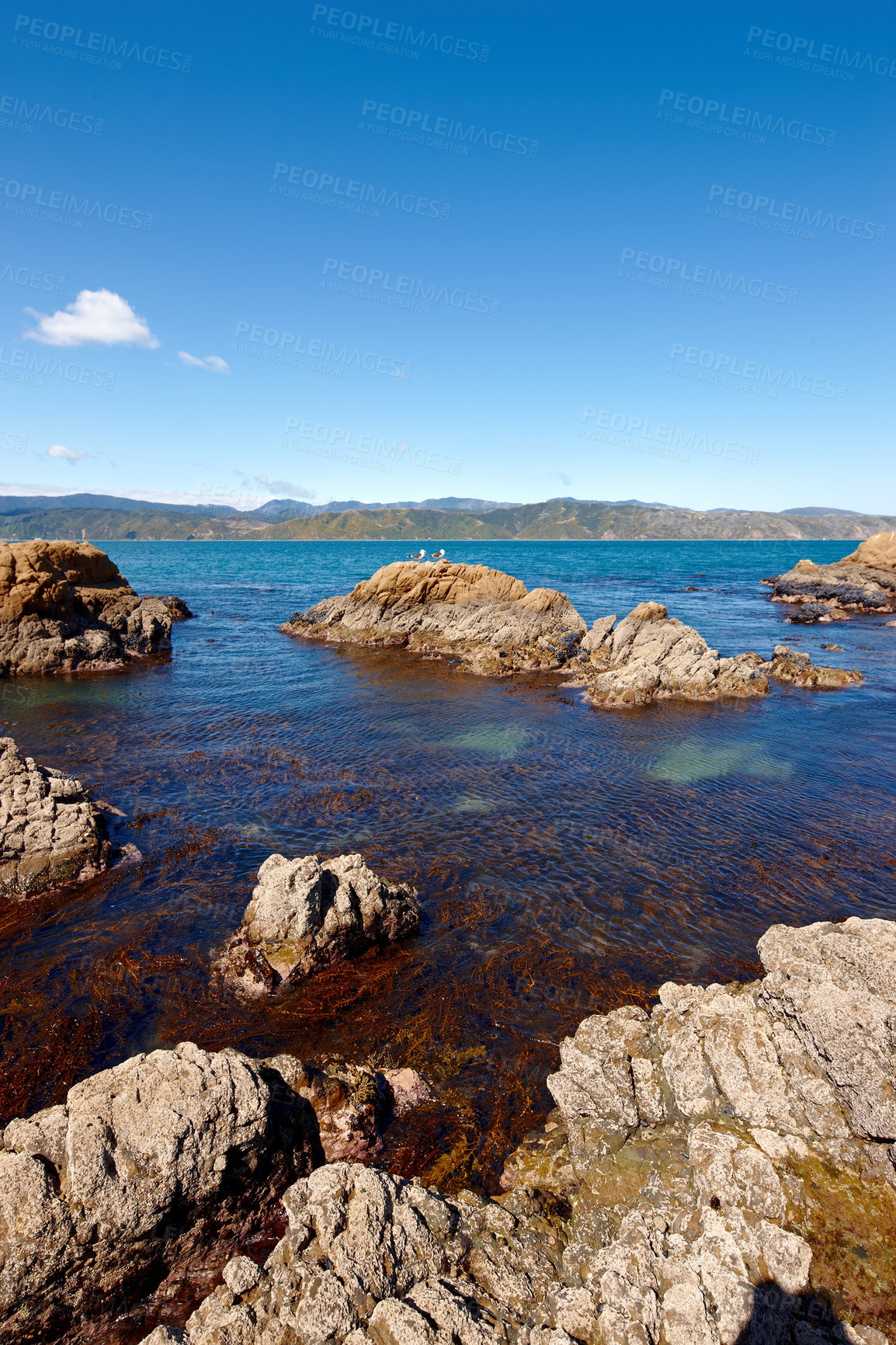 Buy stock photo Landscape, relax and rock with beach and ocean for environment, travel destination and tropical. Summer vacation, water and nature with sea horizon for mediterranean coastline, holiday and paradise