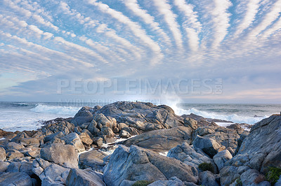 Buy stock photo Landscape, ocean and rocks in nature for wallpaper, high tide and natural environment in South Africa. Water, seascape and cloudy sky at coast for background, scenery and tranquility in Cape Town