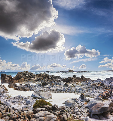 Buy stock photo Landscape, ocean and rocks in sand for travel, destination and coastline in California. Seascape, beach and cloudy sky in summer for holiday, healthy environment and peaceful vacation with scenery