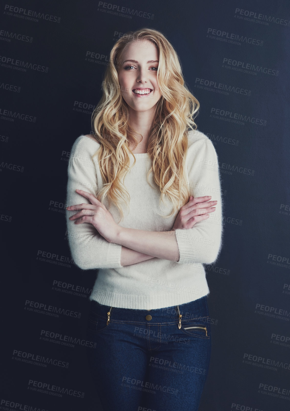 Buy stock photo Studio portrait of a smiling young woman isolated on black