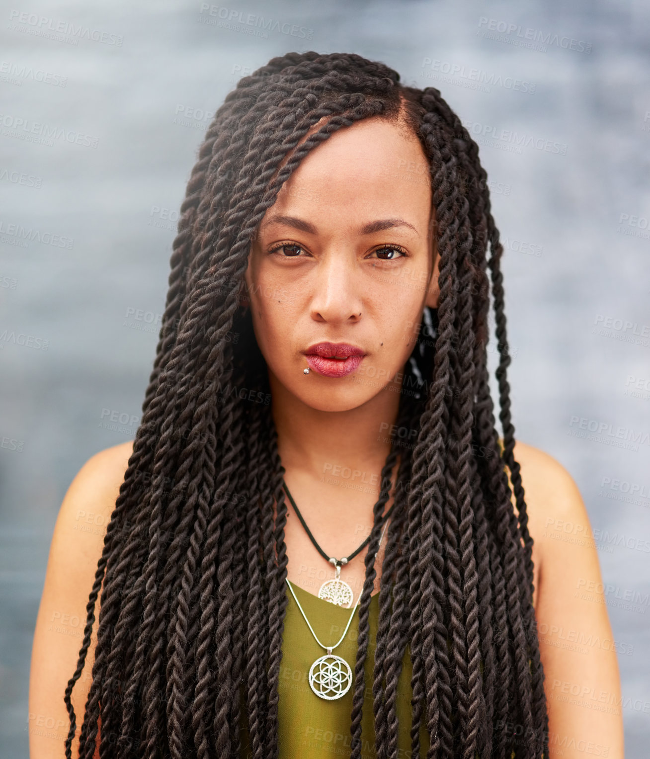 Buy stock photo Portrait of an attractive young woman with beautiful braids posing outdoors