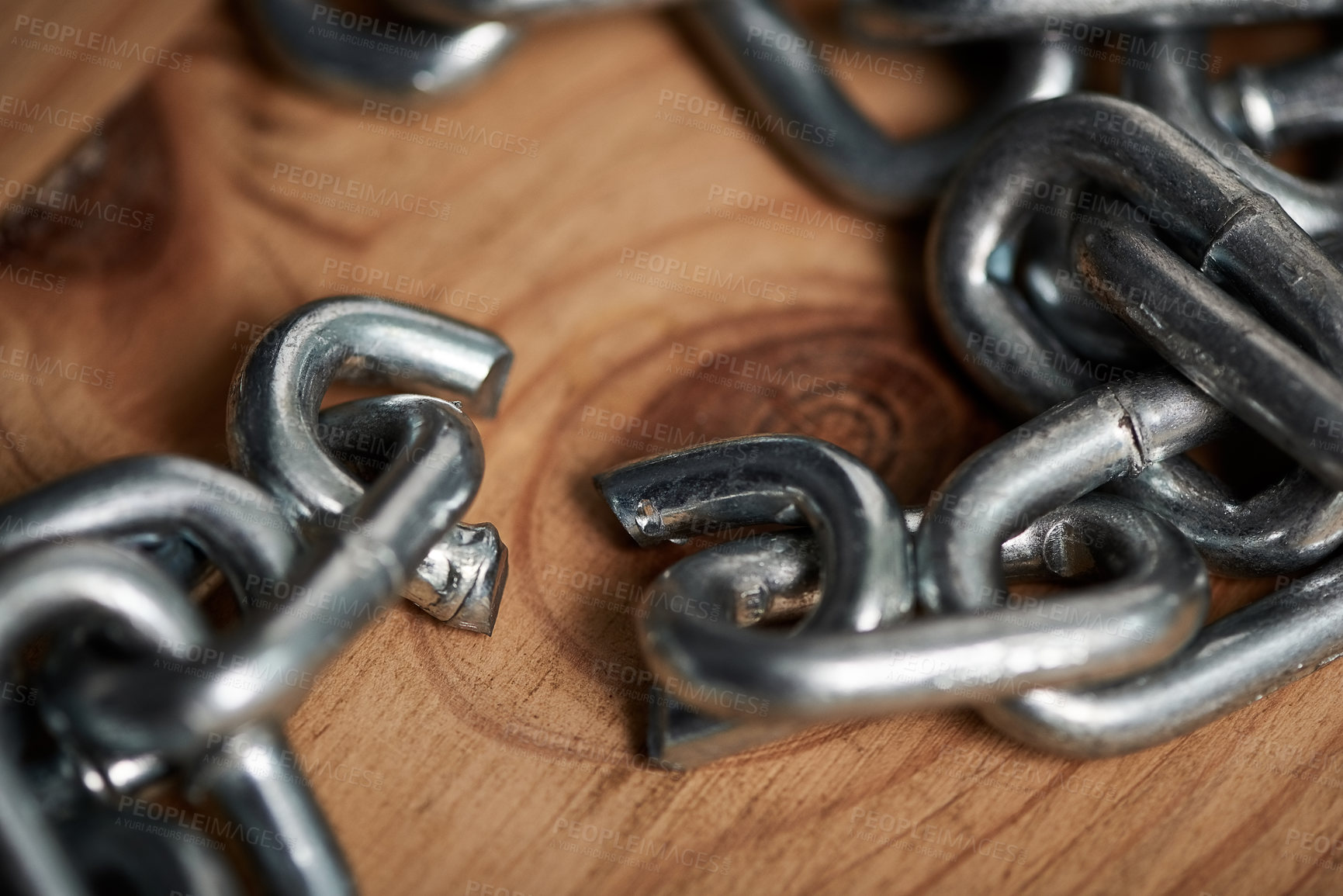 Buy stock photo Shot of metal chains with a broken link