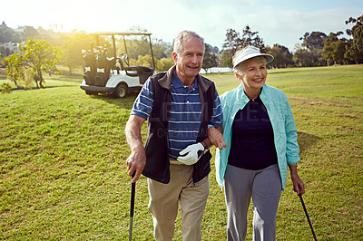 Buy stock photo Golf, hobby and walking with senior couple outdoor on green course together for leisure activity. Grass, love and retirement with mature people playing sports for bonding or recreation in summer