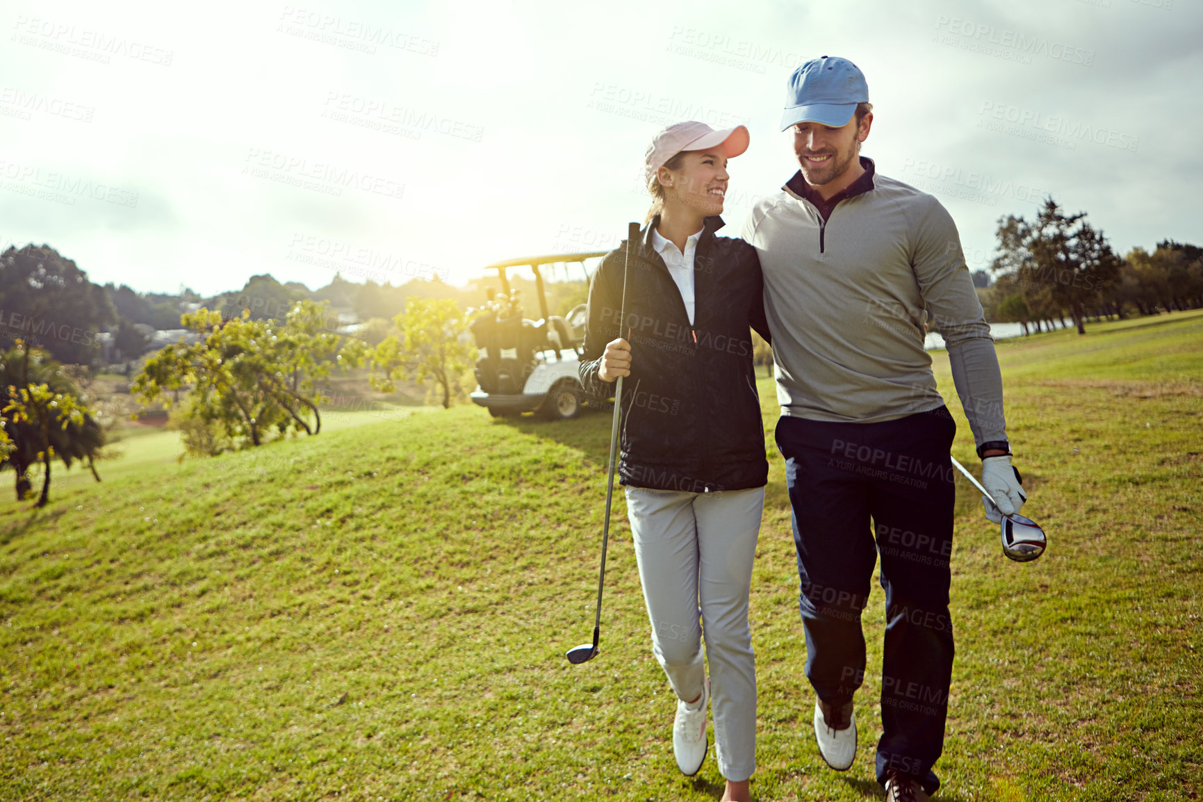 Buy stock photo Golf, nature and couple on field for sports together at country club for leisure activity. Course, happy and young man and woman with smile playing game for bonding, hobby or date in marriage outdoor