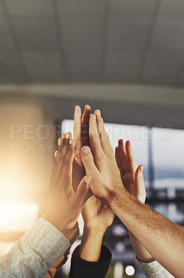 Buy stock photo Shot of a group of colleagues giving each other a high five