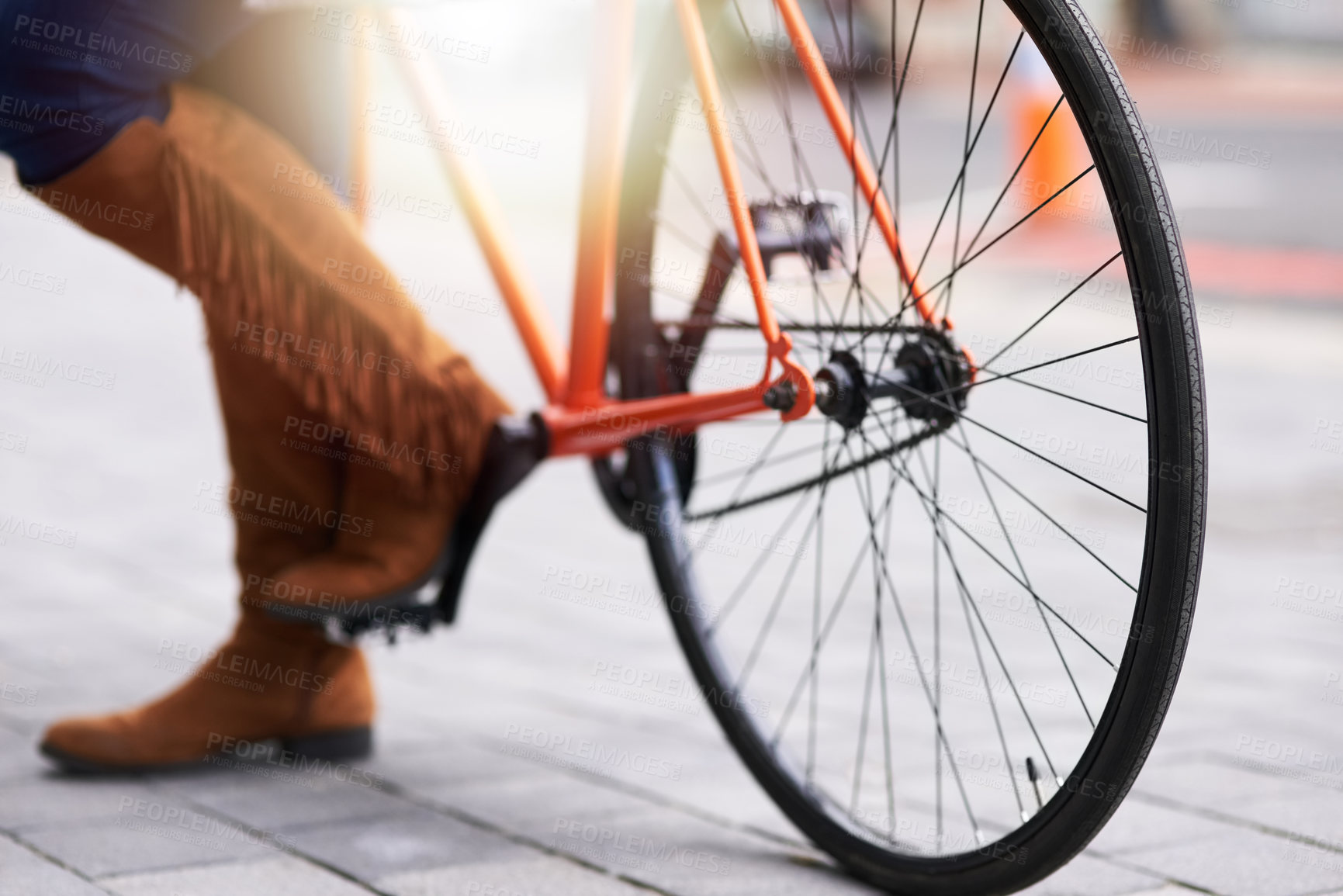 Buy stock photo Cropped shot of a woman standing alongside a bicycle