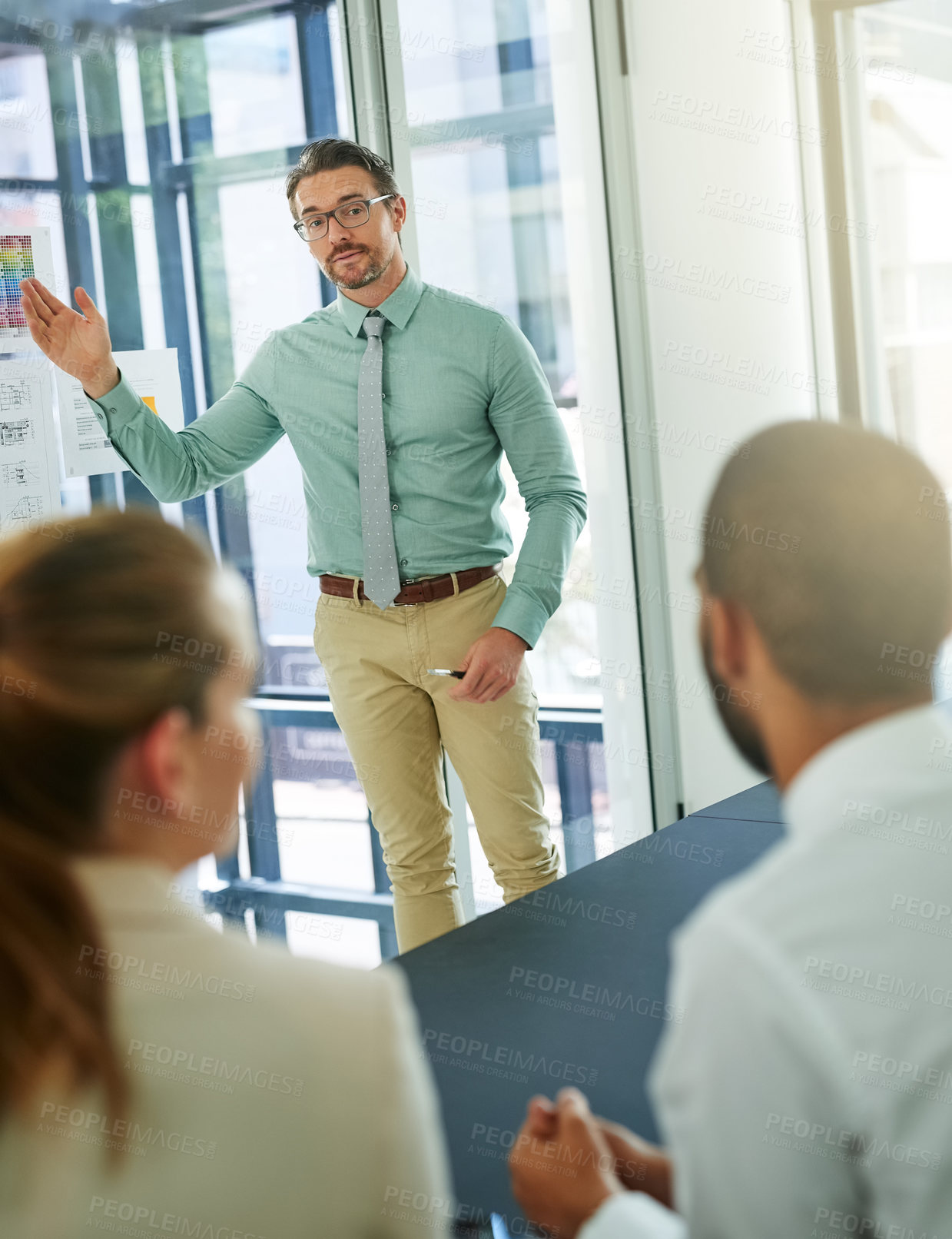 Buy stock photo Businessman, talking or presentation on office glass wall for interior design teaching, feedback or information. Speaker, manager or training learning team on color chart in creative review workshop