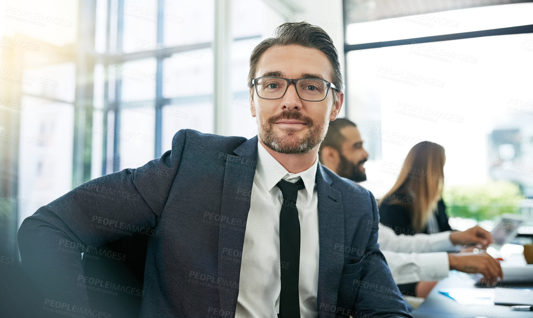 Buy stock photo Cropped portrait of businessman sitting in a meeting