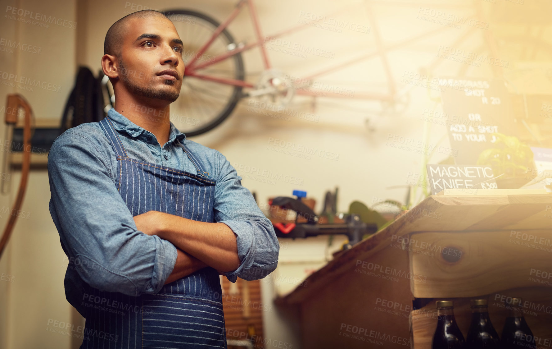 Buy stock photo Small business, man and arms crossed as bicycle mechanic with thinking, pride and confidence for workshop growth. Male person, employee and handyman at garage for repairs, maintenance and service