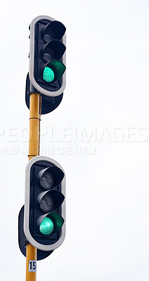 Buy stock photo Traffic light, green and city intersection on street for go instruction, transportation or downtown. Road safety, commute and urban rules for traveling directions or infrastructure, driving or public