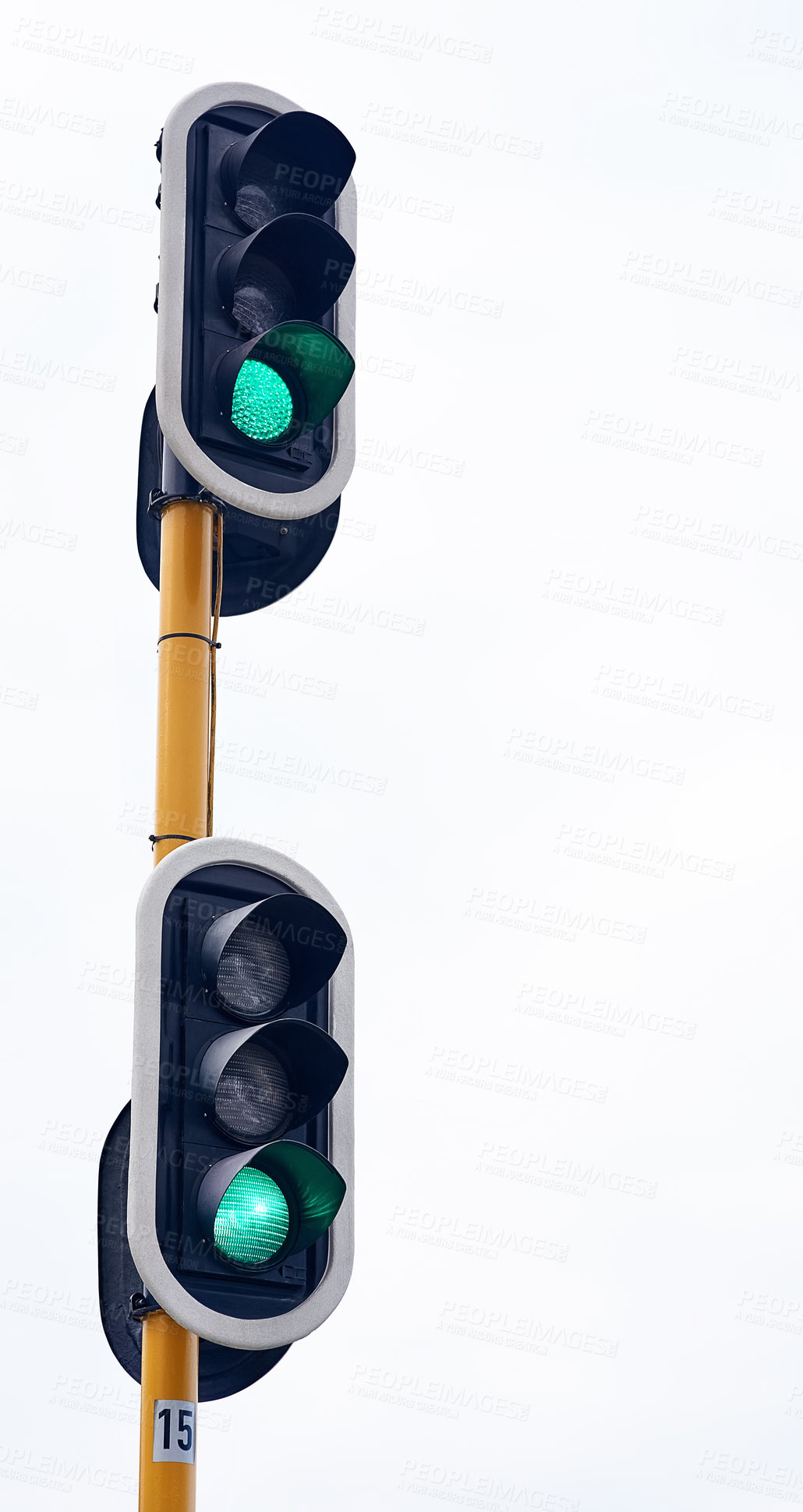 Buy stock photo Traffic light, green and city intersection on street for go instruction, transportation or downtown. Road safety, commute and urban rules for traveling directions or infrastructure, driving or public