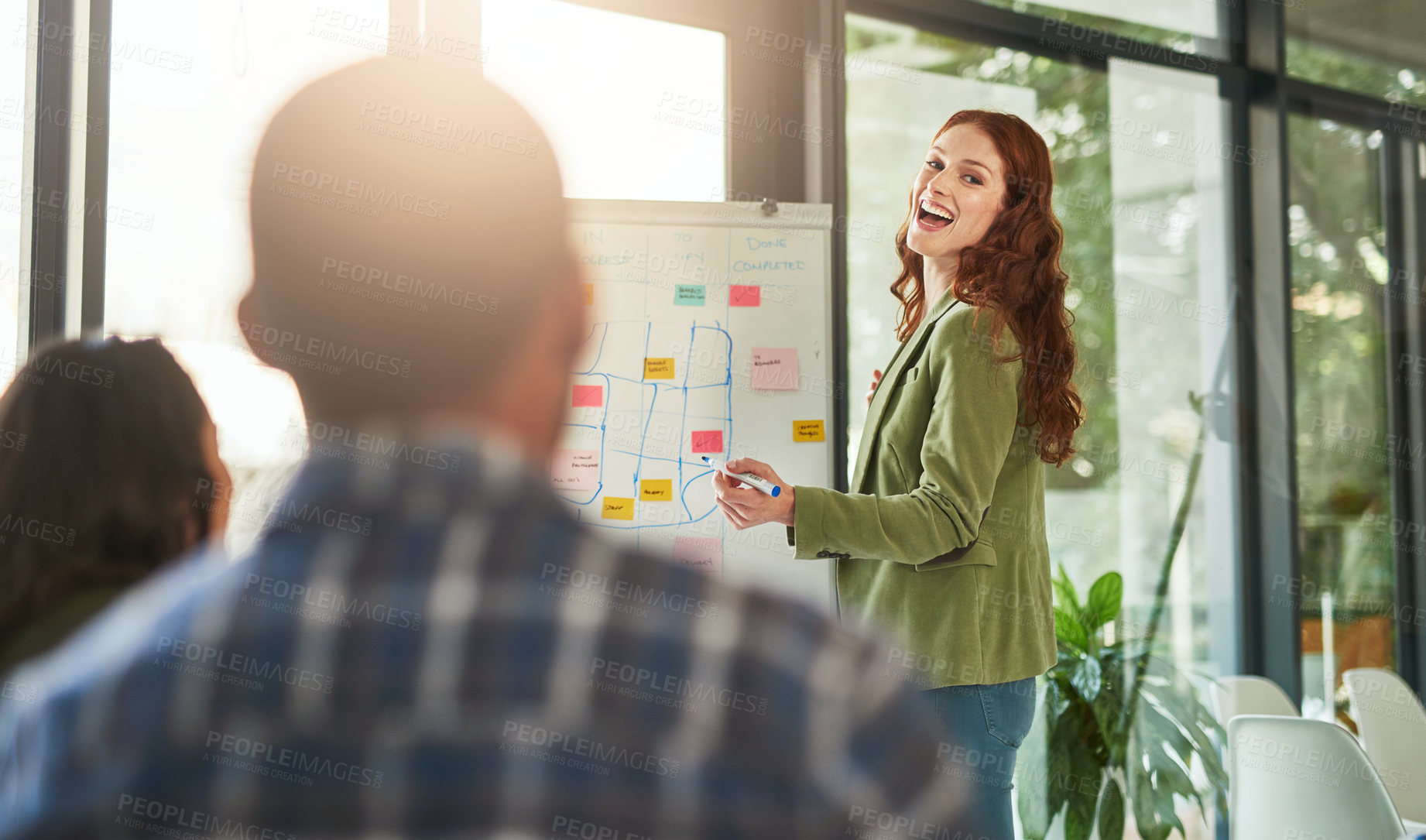 Buy stock photo Cropped shot of a businesswoman giving a presentation to her coworkers in a modern office