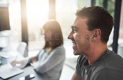 Buy stock photo Cropped shot of coworkers sitting in an office