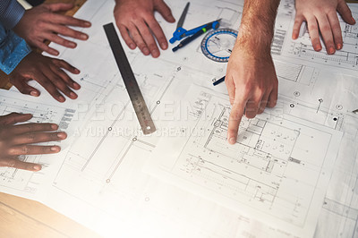 Buy stock photo Closeup shot of architects working together on a project in an office