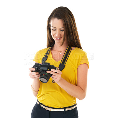 Buy stock photo Shot of a young woman holding her camera against a white background
