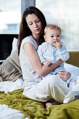 Buy stock photo Baby, mother and sad with postpartum on bed at family house and problem with stress or being tired. Mom, newborn and depression with mental health at home with insomnia about child development. 