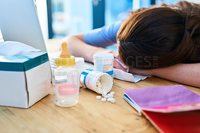 Buy stock photo Cropped shot of a young woman feeling unwell at home