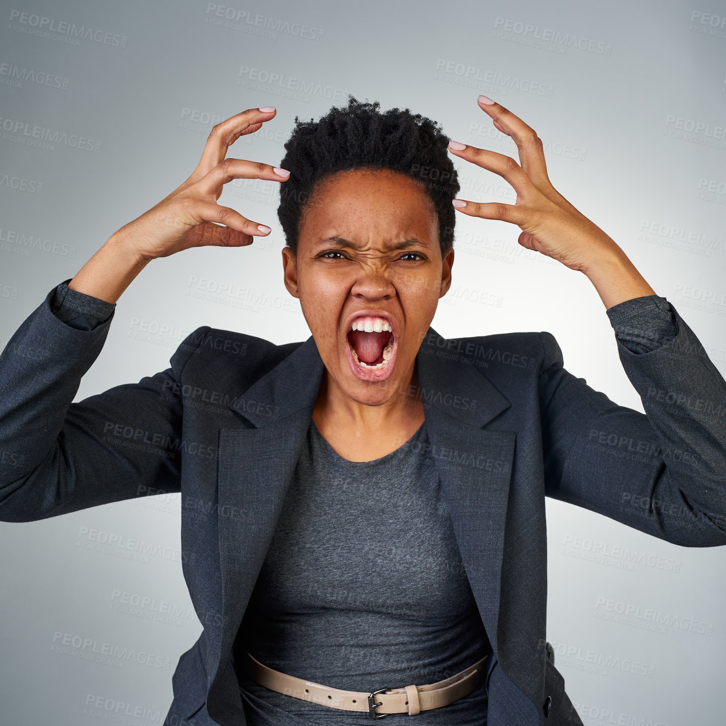 Buy stock photo Portrait of an angry businesswoman yelling against a grey background