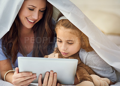 Buy stock photo Blanket, tablet and mother with child on bed at home watch online video on app, internet or social media. Smile, love and mom with girl streaming movie, film or show on digital technology in bedroom