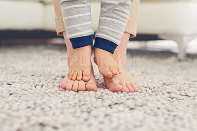 Buy stock photo Cropped shot of a mother and her baby boy's feet together