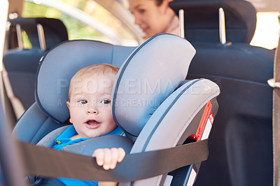 Buy stock photo Cute, baby and car seat with mother for safety, travelling and transportation. Happy, toddler and woman together in vehicle for road trip, adventure or drive to play date or park for bonding
