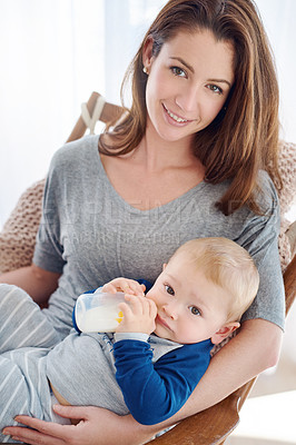 Buy stock photo Portrait, mother and child in feeding, milk and bottle for development, motor skills and childhood at home. Woman, baby and nursing for health, nutrition and support in nursery for growth or wellness