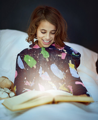Buy stock photo Cropped shot of a girl reading a book in bed