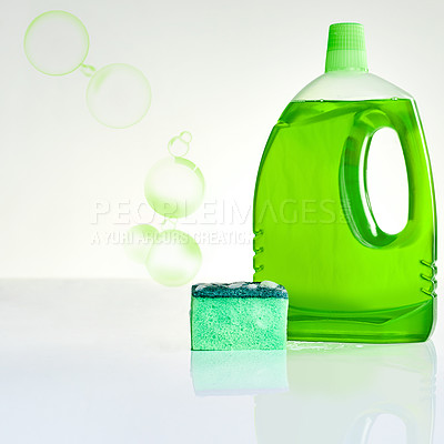 Buy stock photo Bubble, soap and bottle with sponge for cleaning germs, dirt or bacteria in home with product placement. Housekeeping, eco friendly detergent or foam on white background for washing dishes on mockup