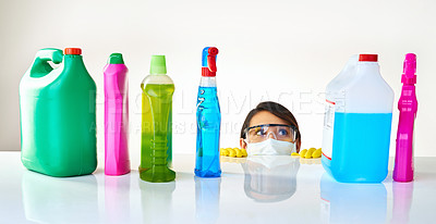 Buy stock photo Detergent bottles, product and woman with mask or glasses for protection, safety and cleaning at home. Housekeeping, cleaner or female person with soap, liquid container or spray on table for dust