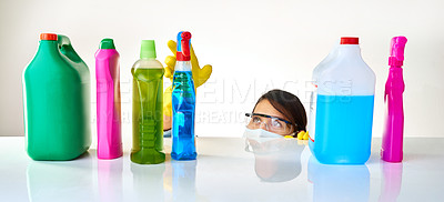 Buy stock photo Detergent, products and woman with mask for cleaning or glasses for protection, safety and soap at home. Housekeeping, cleaner or female person with bottles, liquid container or spray on table