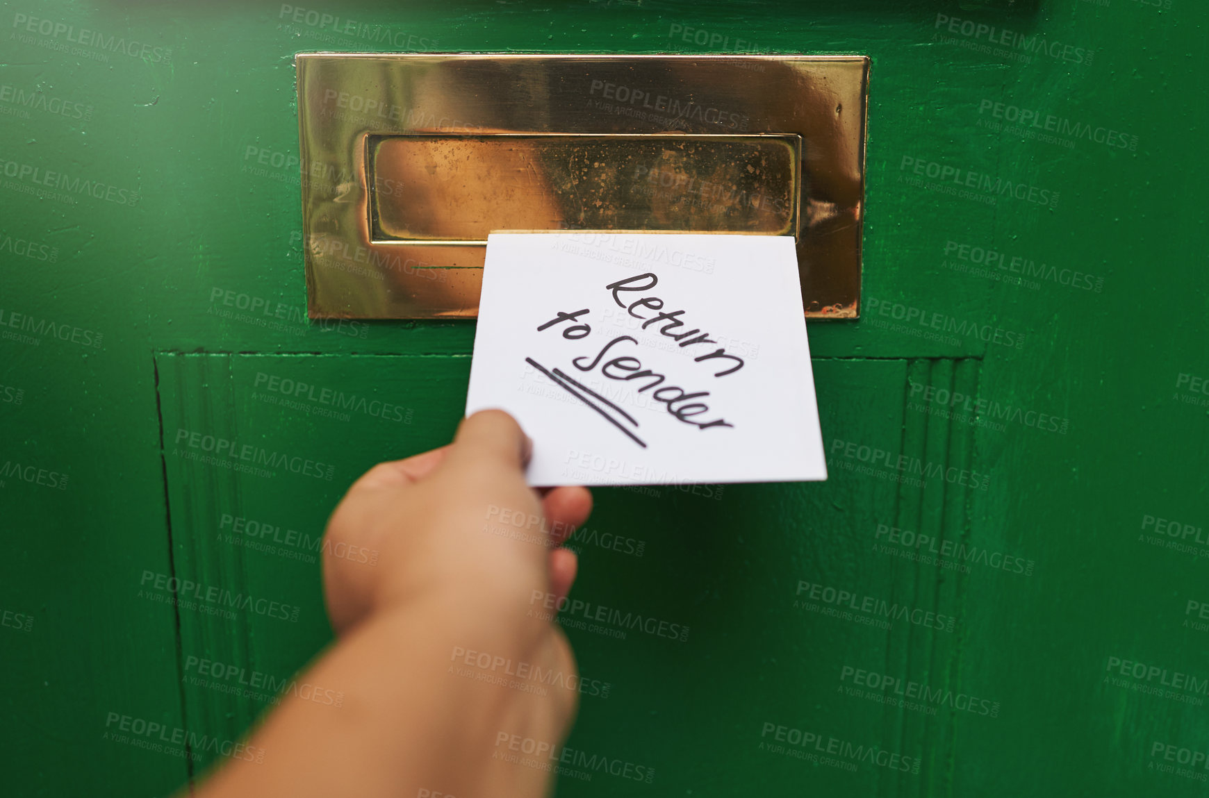 Buy stock photo Cropped shot of a person inserting a letter into a letter box