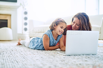 Buy stock photo Cropped shot of a mother and daughter using a laptop together at home