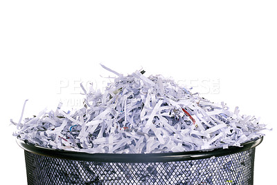 Buy stock photo Studio shot of shredded paper in a dustbin against a white background