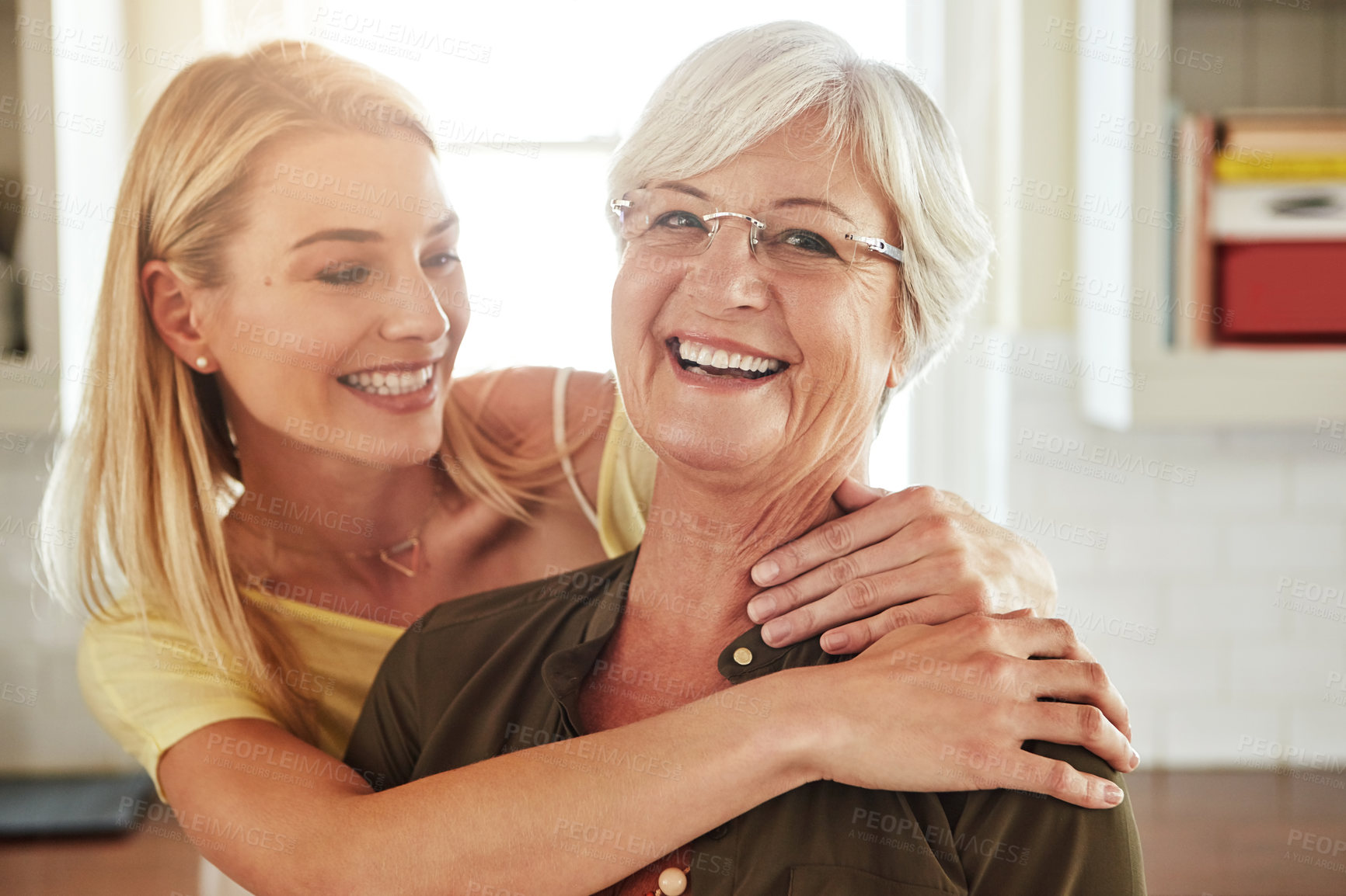 Buy stock photo Cropped shot of a senior woman and her adult daughter at home