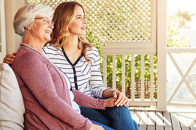 Buy stock photo Cropped shot of a senior woman sitting outside with her adult daughter