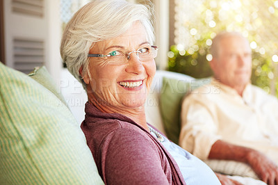 Buy stock photo Cropped portrait of a senior couple sitting outdoors