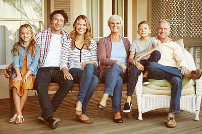 Buy stock photo Full length portrait of a family of six sitting outside