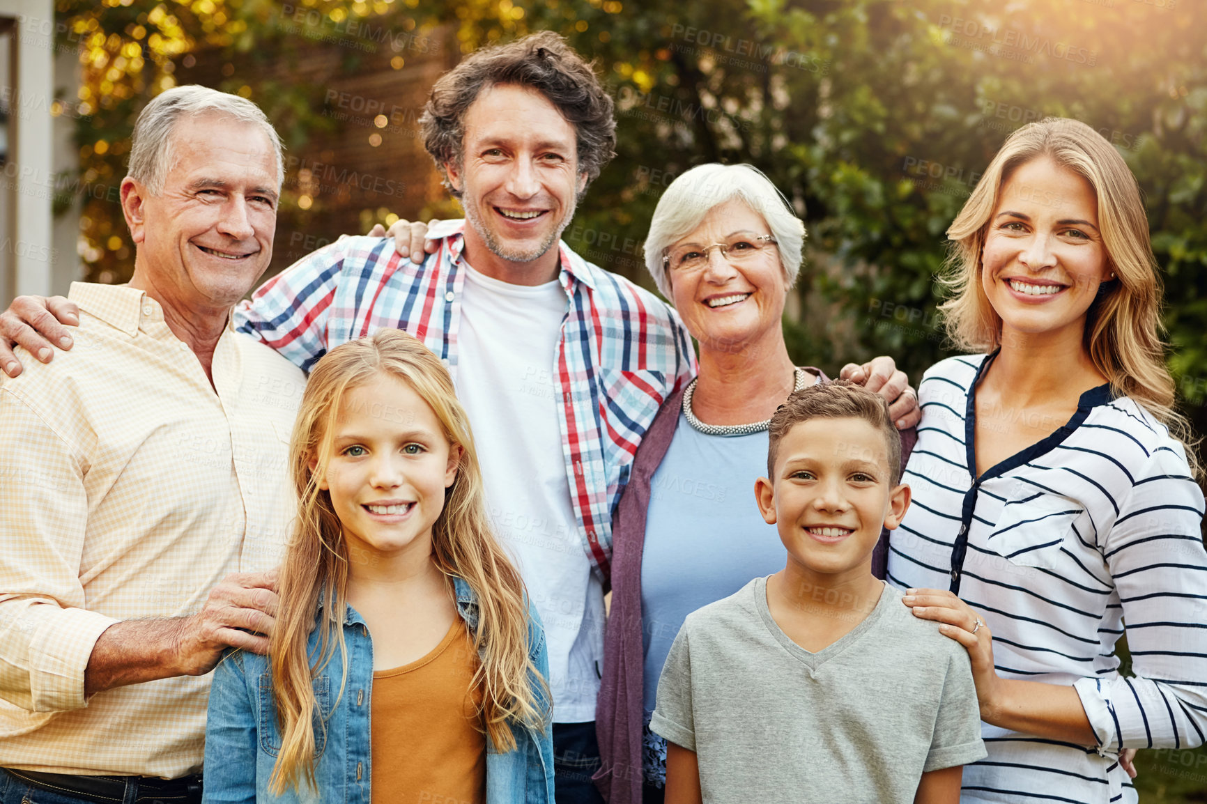 Buy stock photo Portrait of a happy three generational family outdoors