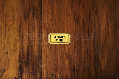 Buy stock photo Single, ticket and movie entry for event, entertainment and vintage token with theater industry or media. Concert, film festival or circus show in Hollywood, retro coupon on wood desk and reservation
