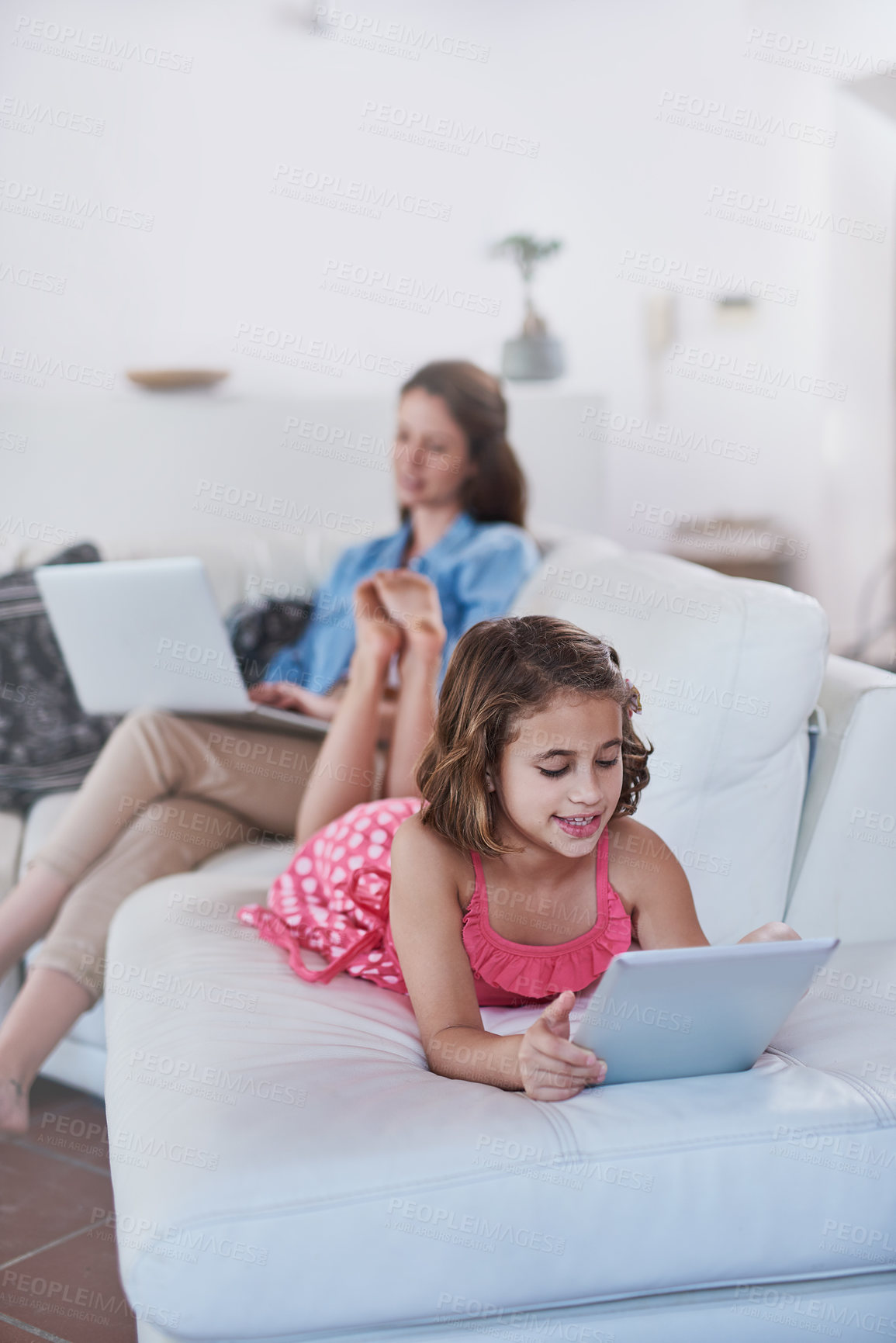 Buy stock photo Mother, child and tablet or laptop in home for online streaming for entertainment, movie or internet. Woman, daughter and connectivity on sofa or relax together in living room, games or subscription