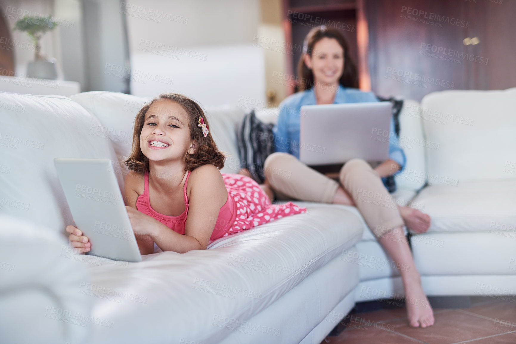 Buy stock photo Girl, child and tablet with mother and laptop, relax with technology for streaming subscription and internet at family house. Woman, working from home and daughter with gaming or elearning with smile