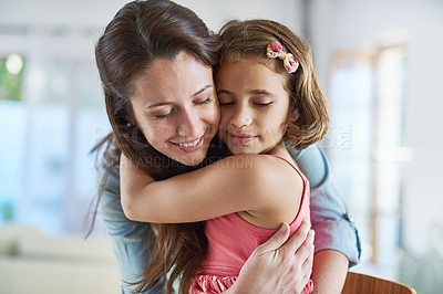 Buy stock photo Cropped shot of a mother hugging her daughter from behind