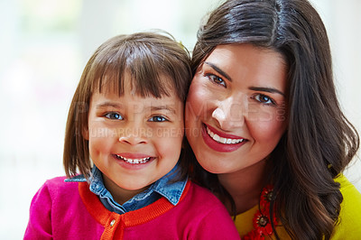 Buy stock photo Portrait of an adorable little girl and her mother bonding at home