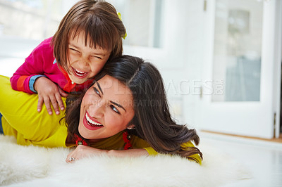 Buy stock photo Shot of an adorable little girl and her mother bonding at home