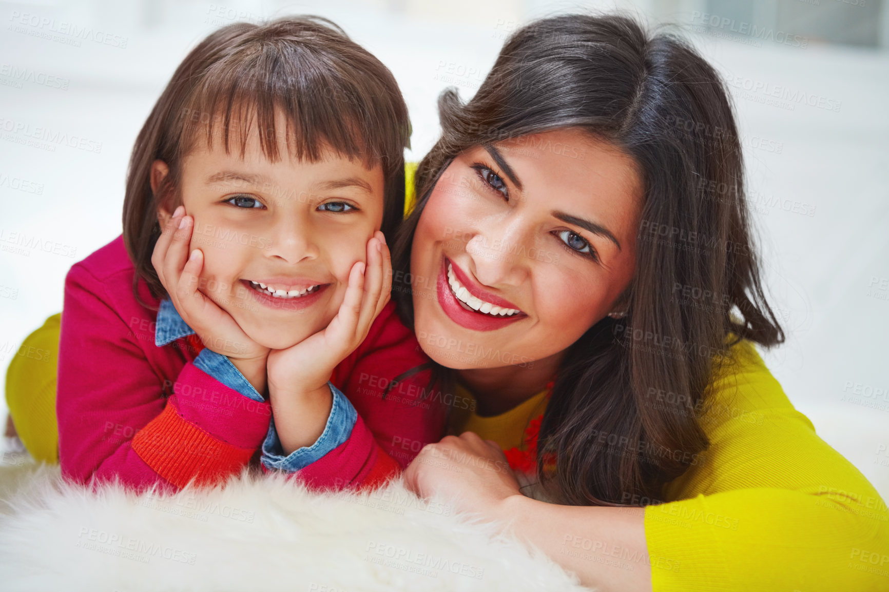 Buy stock photo Portrait of an adorable little girl and her mother bonding at home