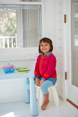 Buy stock photo Portrait of an adorable little girl having a tea party at home